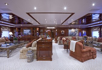 classically-styled main salon with large seating areas on board charter yacht Martha Ann