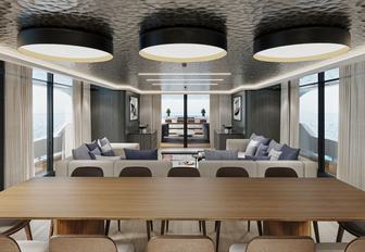 Charter yacht LOEWE dining area with long table