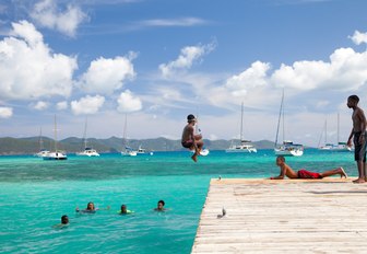 People jumping into sea in US Virgin Islands