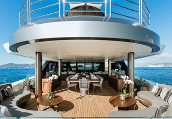 al fresco dining area on the upper deck aft of motor yacht SOLO 