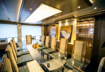 glass-topped table in main salon of luxury yacht SERENITY