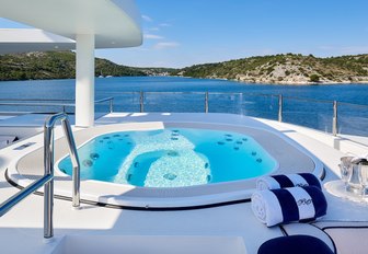 jacuzzi on yacht, with coastlines of croatia in background