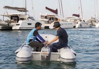 a tender escorts visitors across Royal Phuket Marina at the Thailand Yacht Show & Rendezvous 