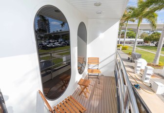 one of the stateroom's balcony with table and chairs on board luxury yacht GLOBAL 