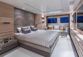 large bed in the master suite of charter yacht DYNAR