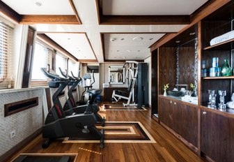 The treadmills lining the gym section of superyacht LEGEND