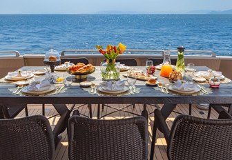 gorgeous banquet served one the alfresco dining table of luxury superyacht ANAMEL