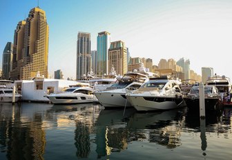 yachts line up in Dubai Marina for boat show