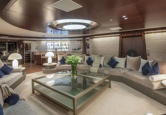 huge sofas in the main salon of charter yacht KATINA