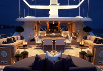 rotating sunbed, dining table and seating on the sundeck of luxury yacht SEALYON