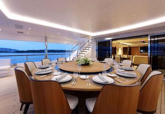 circular alfresco dining table on the aft deck of luxury yacht FORMOSA 