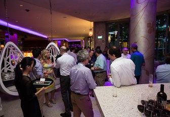 show attendees gather at a party at the Singapore Yacht Show 