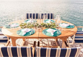luxe alfresco dining area on the aft deck of motor yacht SPIRIT