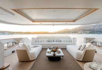 sumptuous outdoor lounge on the main deck aft of motor yacht K