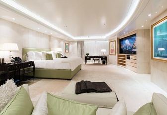 owner's suite on luxury yacht lady e, with green accents and spacious interiors