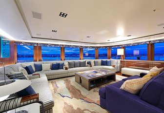 salon with huge sofa on board charter yacht Planet Nine 
