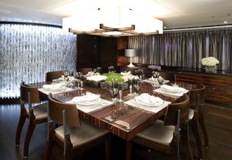high gloss dining table and Murano glass wall aboard luxury yacht INCEPTION