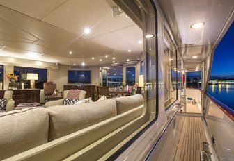 main salon seen from the side deck aboard superyacht ‘Sweet Escape’