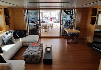 seating and TV in the upper salon on board charter yacht AWOL