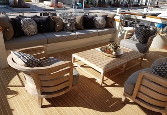 outdoor lounge with teak furniture on the sundeck of motor yacht AWOL