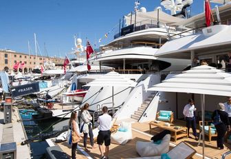 industry professionals check out the yachts at the MYBA Charter Show