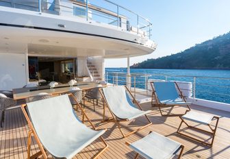 deckchairs and alfresco dining area on the upper deck aft of superyacht NARVALO 