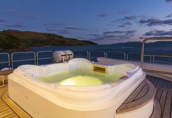 spa pool on the sundeck of luxury yacht SILENTWORLD lights up at night