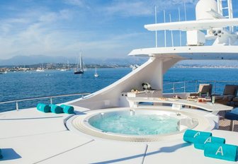 Jacuzzi surrounded by sun pads on the sundeck of motor yacht Big Sky 