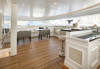 enclosed dining area with a bar on board charter yacht Spirit of the C’s