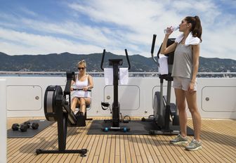 charter guests work out on gym equipment on board superyacht TURQUOISE 