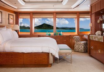 full-beam master suite with large windows aboard luxury yacht OASIS