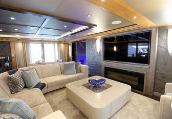 intimate seating area with fireplace in skylounge aboard motor yacht SERENITY