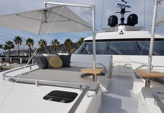 foredeck lounging area with shade on board charter yacht AWOL