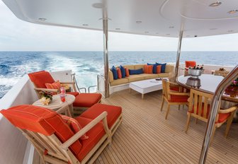 alfresco dining and lounge options on main deck aft of charter yacht 'Chasing Daylight'