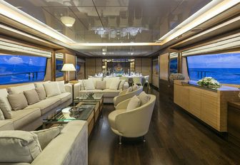 Sumptuous lounge area with dining table beyond on board motor yacht RINI
