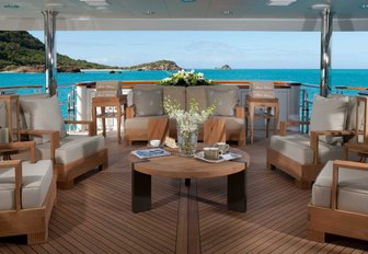 chic outdoor seating area on the aft deck of charter yacht IMPROMPTU 