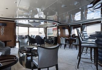 silver and navy-themed skylounge aboard motor yacht LIBERTY with seating areas and bar
