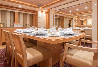 formal interior dining area aboard motor yacht EMOJI 