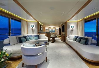 sumptuous sofas in the main salon of charter yacht SOLIS 