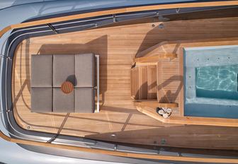 View from above of sunloungers and pool on board superyacht GECO