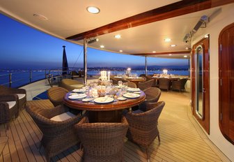 An alfresco dining section on board luxury yacht SHERAKHAN