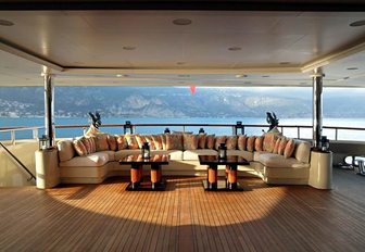 spacious main deck aft with large U-shaped sofa on board motor yacht ULYSSES 