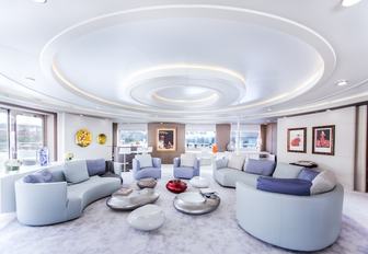 chic salon with curved sofas on board luxury yacht SALUZI