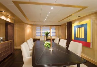 formal dining area in the main salon of charter yacht Deep Blue II