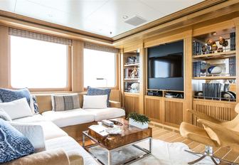 laid back seating area with TV in the skylounge of motor yacht HELIOS