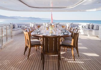 beautiful alfresco dining area on upper deck aft of luxury yacht TURQUOISE