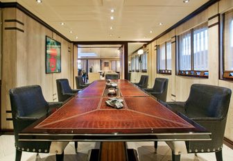 leather-topped table in dining salon of superyacht ‘Force Blue’ 