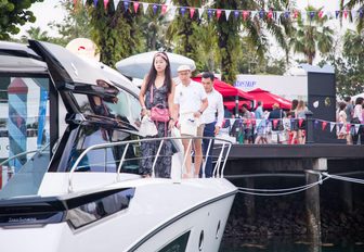 visitors take a tour of a yacht at the Singapore Yacht Show