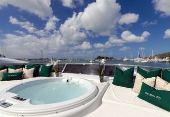 spa pool surrounded by sun pads on the sundeck of superyacht One More Toy 