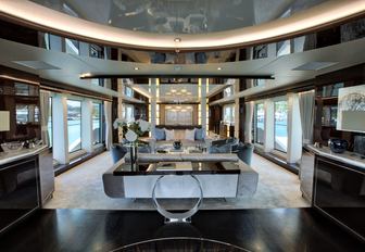 main salon flanked by full-length windows on board superyacht Take 5